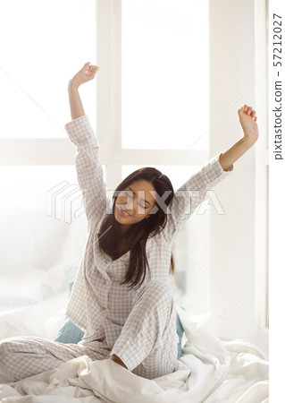 Asian Woman Waking Up. Asian Woman Waking Up. 57212027