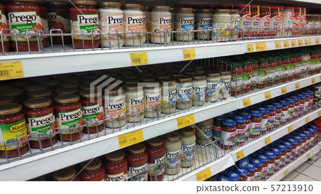 Selective focused of Prego Sauce in cans placed on the rack for sale inside the supermarket. 57213910