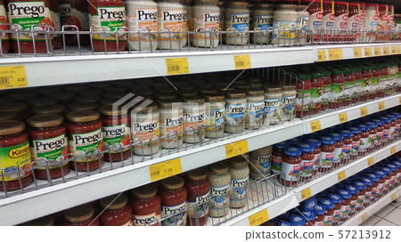 Selective focused of Prego Sauce in cans placed on the rack for sale inside the supermarket. 57213912
