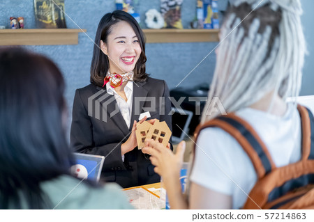 Young female staff at a real estate agency for foreigners who are driven by inbound demand Young female staff at a real estate agency for foreigners who are driven by inbound demand 57214863