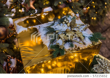 Christmas gold box with gifts. Golden balls and Christmas gold box with gifts. Golden balls and 57215832