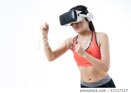 Woman exercising in VR Virtual Reality Fitness Woman exercising in VR Virtual Reality Fitness 57217337