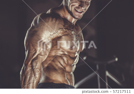 Brutal strong men workout bodybuilding background - muscular bodybuilder men doing exercises in gym Brutal strong men workout bodybuilding background - muscular bodybuilder men doing exercises in gym 57217511