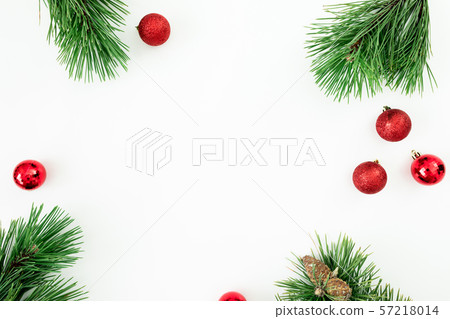 Christmas frame made of evergreen branches and balls on white background. Flat lay, top view 57218014