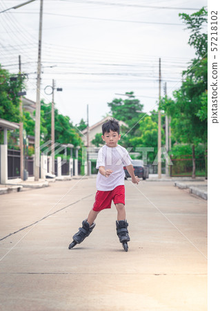Asian boy is playing rollerblade 57218102