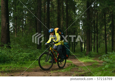 cyclist hiker in the autumn forest cyclist hiker in the autumn forest 57218769