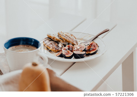 Pumpkin pancakes with figs on white wooden table 57221306