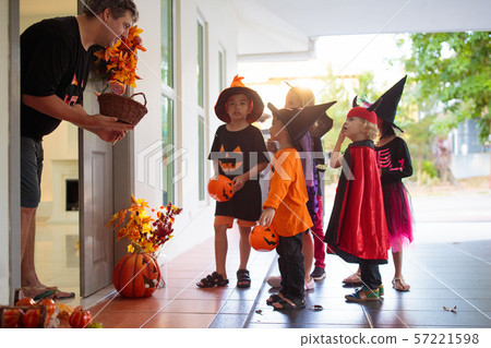 Kids trick or treat. Halloween. Child at door. Kids trick or treat. Halloween. Child at door. 57221598
