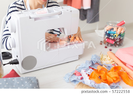 clothing designer, seamstress, people concept - clothing designer working in her studio clothing designer, seamstress, people concept - clothing designer working in her studio 57222558