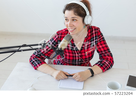 Radio host concept - Portrait of woman radio presenter with headphones 57223204