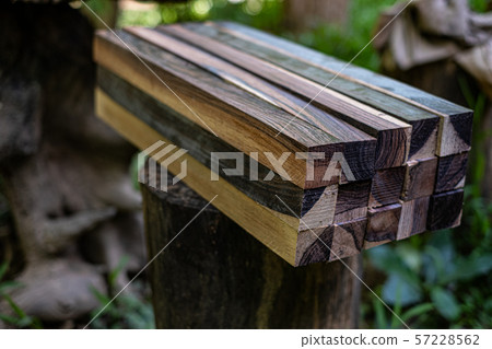 Logs woods of Burma blackwood on blurred background 57228562