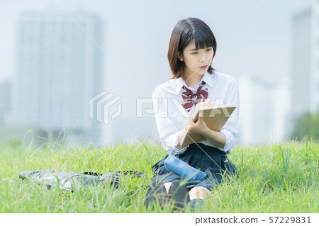 High school girl studying outdoors High school girl studying outdoors 57229831