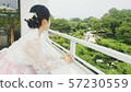 Side view of a woman wearing a hanbok 57230559