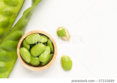 Sato seeds, Bitter bean in the Wooden bowl isolated on white background 57232689