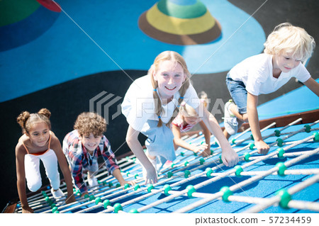 Children feeling involved in climbing all together 57234459
