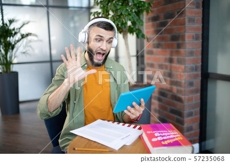Emotional student having video lesson in foreign language 57235068