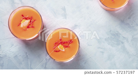 Salmorejo, Spanish cold tomato and bread soup, served in glasses, overhead panoramic shot with copy Salmorejo, Spanish cold tomato and bread soup, served in glasses, overhead panoramic shot with copy 57237197