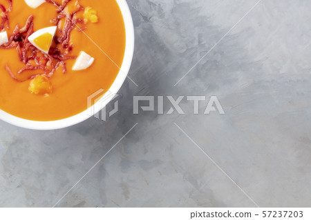 Salmorejo, Spanish cold tomato soup, close-up overhead shot with a place for text 57237203