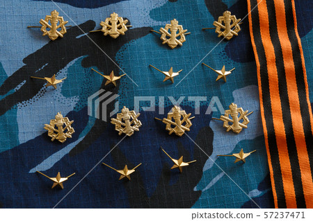 Gold stars, St. George ribbon on blue camouflage Gold stars, St. George ribbon on blue camouflage 57237471