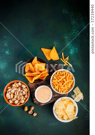 Beer snacks on wooden table 57239440