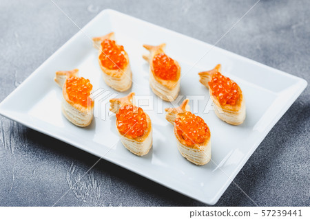 Delicious appetizer with red caviar. Delicious appetizer with red caviar. 57239441