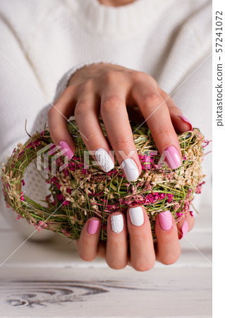 Girl holds a creative gift. 57241072