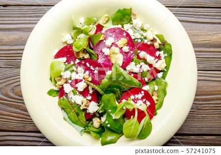 Top view at mediterranean roasted beet salad with Top view at mediterranean roasted beet salad with 57241075