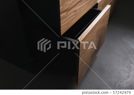 Closeup details of modern tv stand made from walnut and powder coated steed Closeup details of modern tv stand made from walnut and powder coated steed 57242979