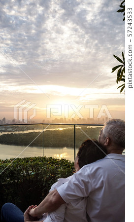 Asian senior couple with morning sunrise on luxury 57243533