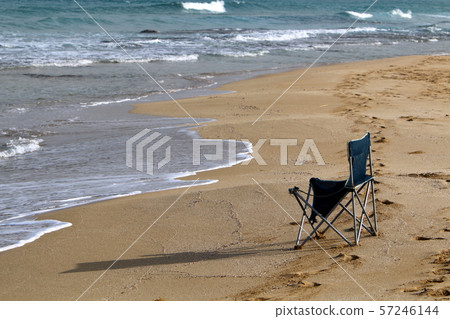 chair and table standing in a cafe on the shores of the Mediterranean in Israel 57246144