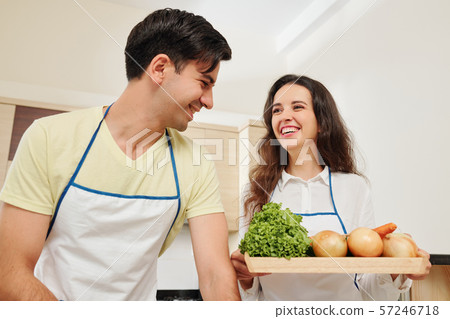 Cheerful couple ready to cook Cheerful couple ready to cook 57246718