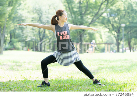 Woman doing yoga in the park 57246884