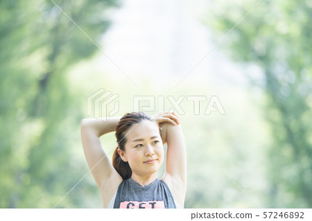 Woman doing yoga in the park 57246892