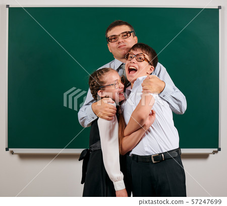Portrait of a teacher, schoolboy and schoolgirl Portrait of a teacher, schoolboy and schoolgirl 57247699