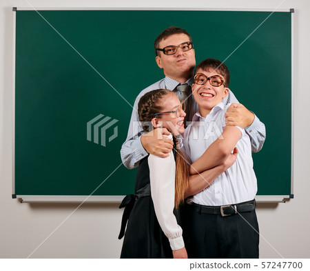 Portrait of a teacher, schoolboy and schoolgirl Portrait of a teacher, schoolboy and schoolgirl 57247700