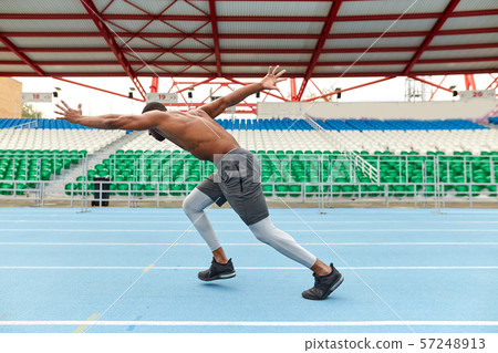 young ambitious sportsman enjoying trainng outdoors 57248913