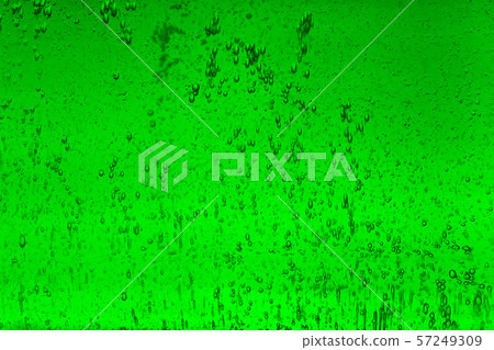 Floating bubbles in green liquid background texture. 57249309