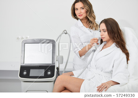 talented specialist doing beauty treatmnet for a client 57249330