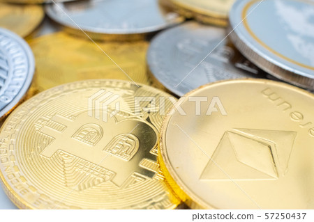 Bunch of Crypto currency coins with focus on BTC Bitcoin Bunch of Crypto currency coins with focus on BTC Bitcoin 57250437