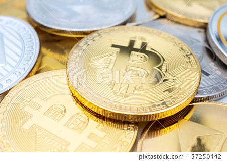 Bunch of Crypto currency coins with focus on BTC Bitcoin Bunch of Crypto currency coins with focus on BTC Bitcoin 57250442