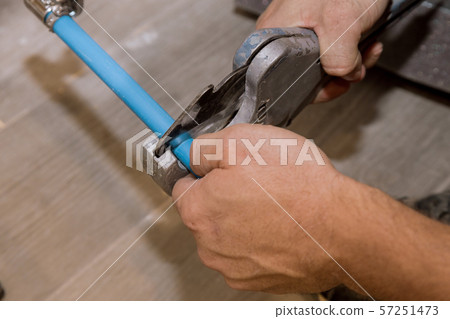 Using a cutter for plastic pipes repairing 57251473
