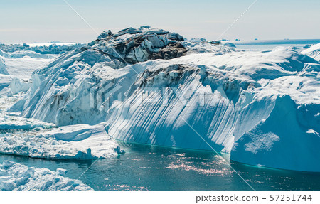 Iceberg and ice from glacier in arctic nature landscape on Greenland 57251744