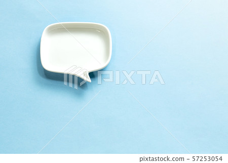 White speech bubble on blue background and left side White speech bubble on blue background and left side 57253054