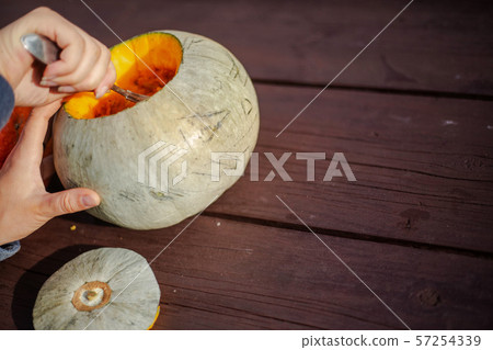 Hollowing out a pumpkin Hollowing out a pumpkin 57254339