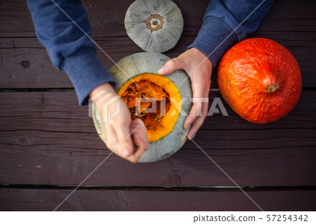 Hollowing out a pumpkin Hollowing out a pumpkin 57254342