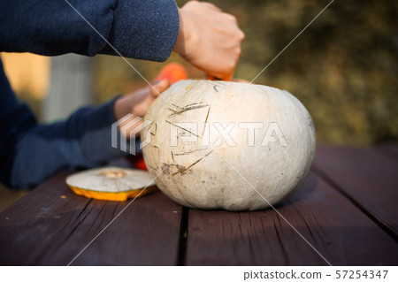 Hollowing out a pumpkin Hollowing out a pumpkin 57254347