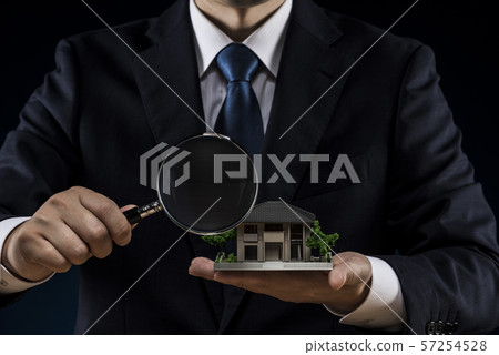House model, loupe, businessman 57254528