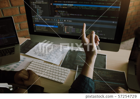 Two software developers are analyzing together 57254729