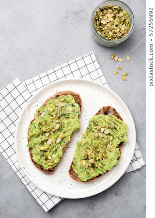Healthy rye bread avocado toast with seeds 57256992