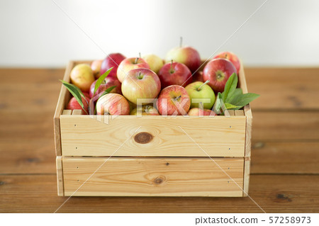 ripe apples in wooden box on table ripe apples in wooden box on table 57258973